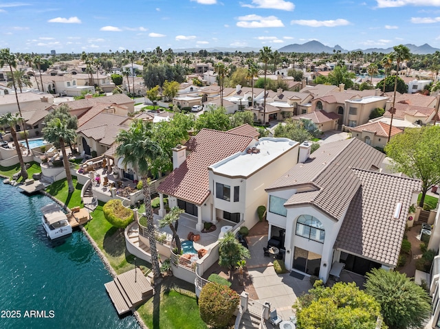 aerial view featuring a residential view and a water and mountain view