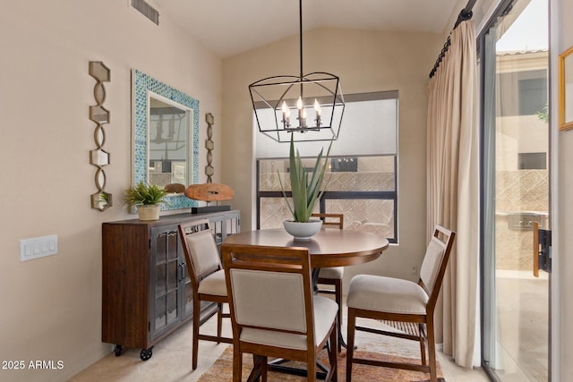 dining area featuring an inviting chandelier, light tile patterned floors, visible vents, and vaulted ceiling