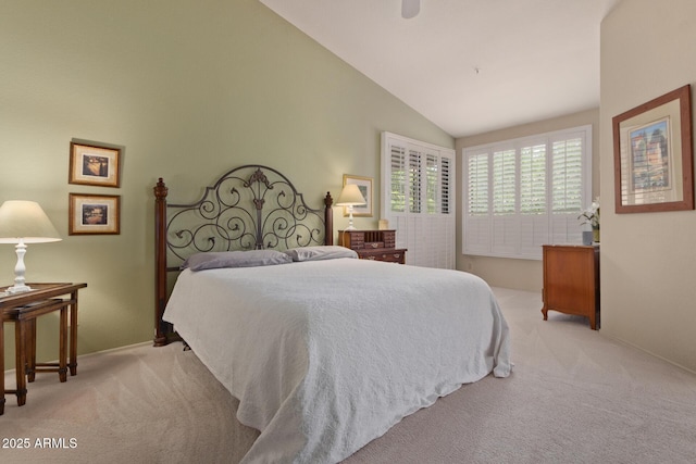 bedroom featuring carpet floors, ceiling fan, and high vaulted ceiling