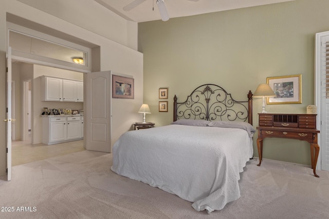 bedroom featuring light carpet and ceiling fan