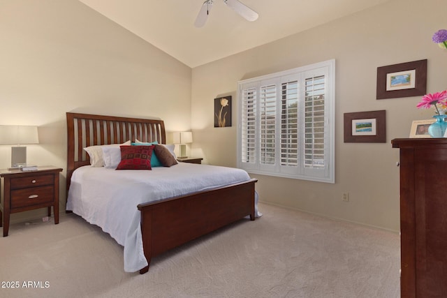 bedroom with lofted ceiling, light colored carpet, and ceiling fan