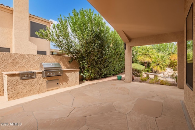 view of patio with exterior kitchen and area for grilling