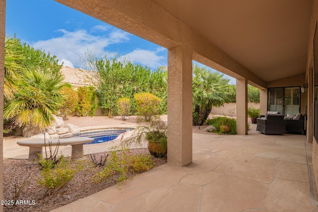 view of patio with a fenced backyard, a fenced in pool, and an in ground hot tub