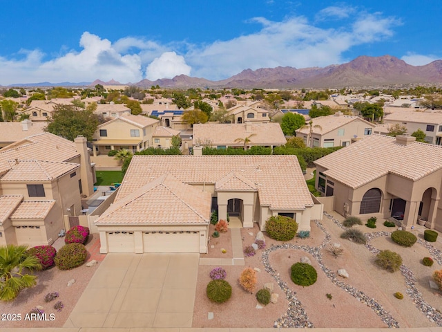 bird's eye view with a residential view and a mountain view