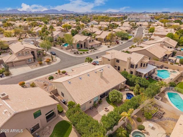 bird's eye view featuring a residential view and a mountain view