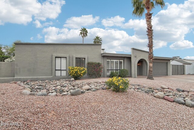 5119 E Shaw Butte Dr, Scottsdale, AZ 85254 - view of front facade featuring a garage, concrete driveway, and stucco siding