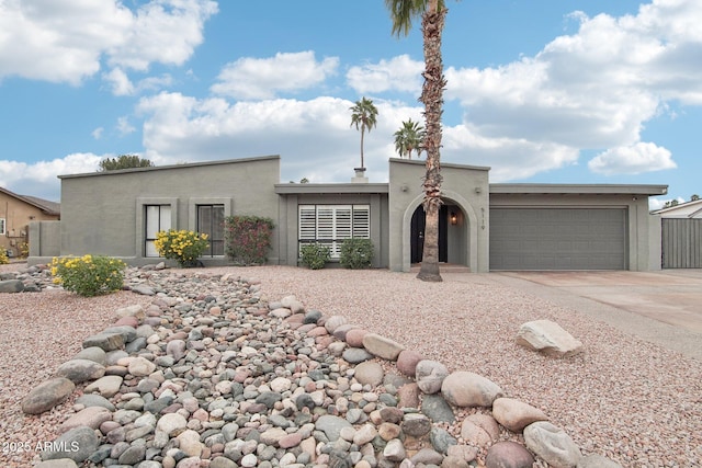 5119 E Shaw Butte Dr, Scottsdale, AZ 85254 - view of front of house featuring driveway, a garage, and stucco siding