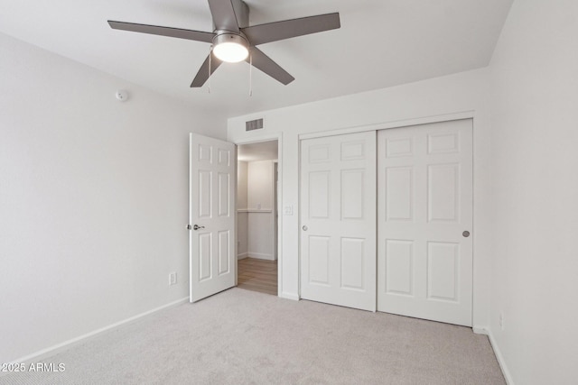 5119 E Shaw Butte Dr, Scottsdale, AZ 85254 - unfurnished bedroom with light carpet, baseboards, a closet, and ceiling fan