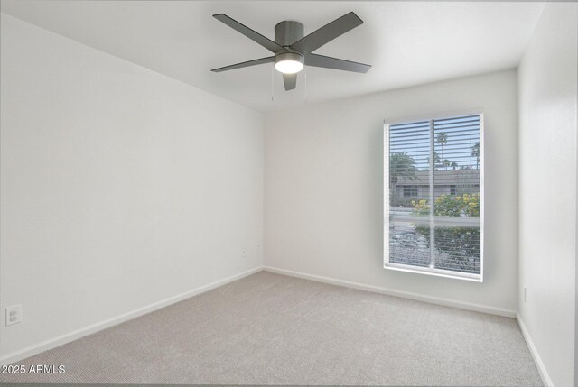5119 E Shaw Butte Dr, Scottsdale, AZ 85254 - unfurnished room featuring light colored carpet, baseboards, and ceiling fan