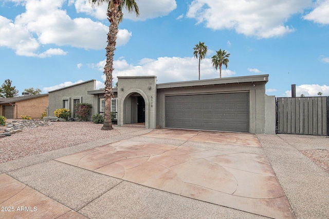 5119 E Shaw Butte Dr, Scottsdale, AZ 85254 - view of front of home featuring stucco siding, driveway, and a garage