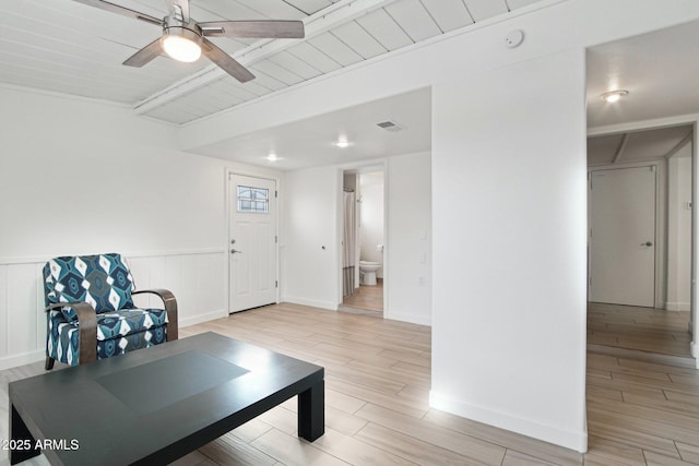 5119 E Shaw Butte Dr, Scottsdale, AZ 85254 - workout room with light wood-type flooring, ceiling fan, and a wainscoted wall