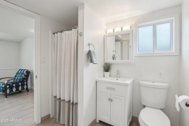 5119 E Shaw Butte Dr, Scottsdale, AZ 85254 - bathroom featuring wood finished floors, vanity, toilet, and curtained shower