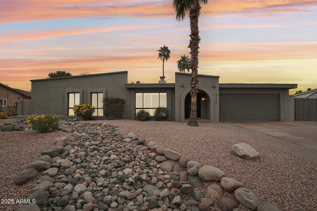 5119 E Shaw Butte Dr, Scottsdale, AZ 85254 - view of front of property featuring an attached garage, driveway, and stucco siding