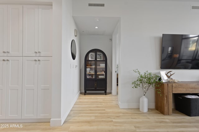 corridor with light wood-type flooring