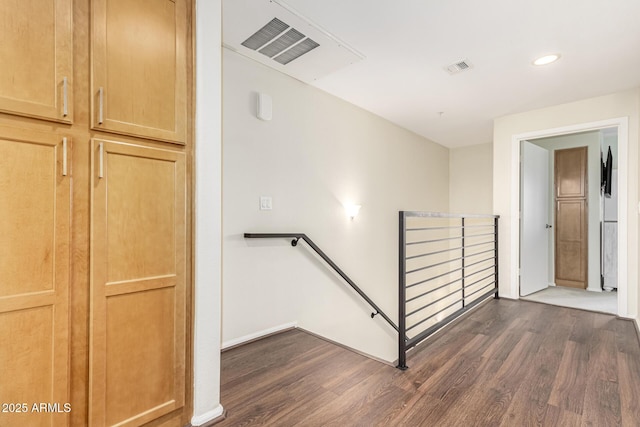 stairs with wood-type flooring