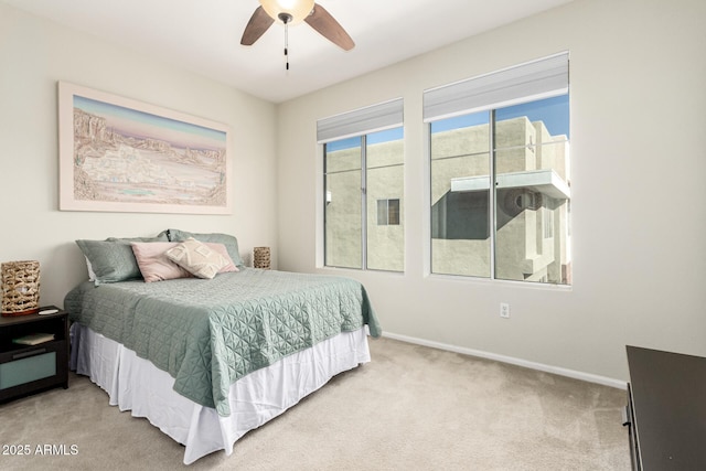 bedroom with ceiling fan and carpet flooring