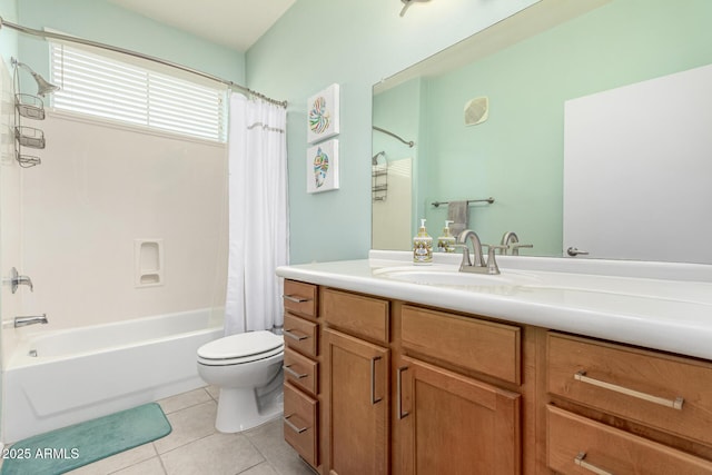 full bathroom with tile patterned flooring, vanity, shower / bath combo with shower curtain, and toilet