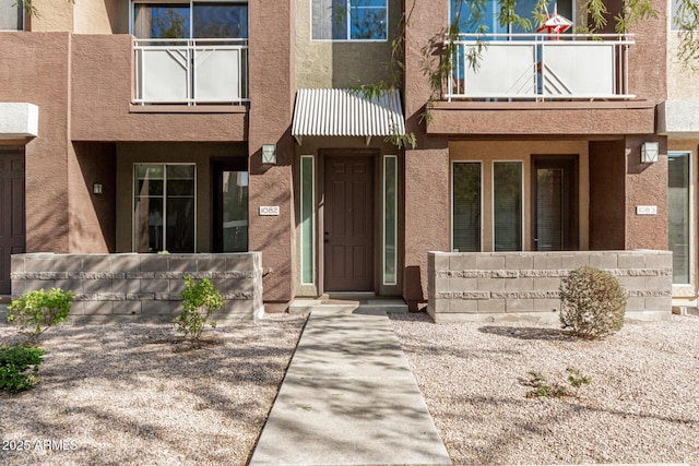 doorway to property featuring a balcony