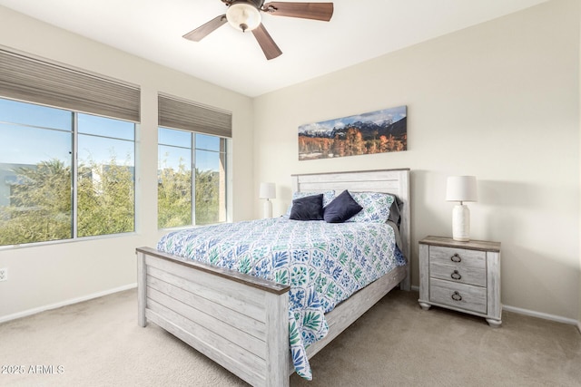 bedroom with light carpet and ceiling fan