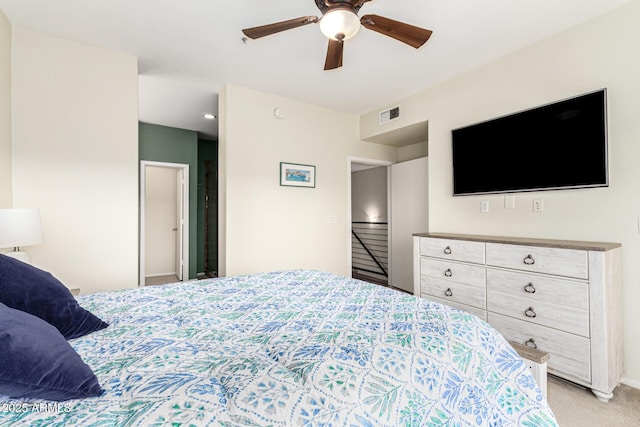 carpeted bedroom with ceiling fan