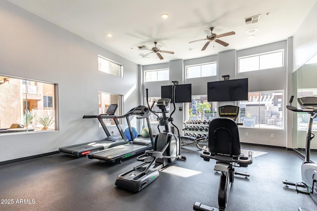 gym with a towering ceiling