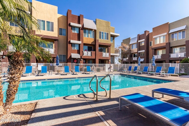 view of swimming pool with a patio area