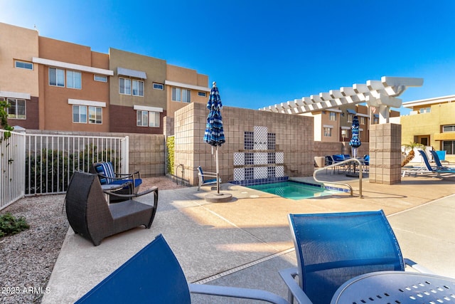 view of pool featuring a community hot tub and a patio area