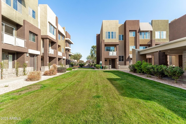 view of home's community featuring a yard