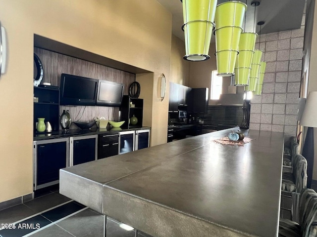 kitchen with backsplash and dark tile patterned floors