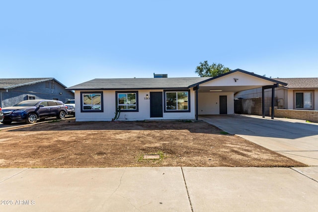 ranch-style house with a carport