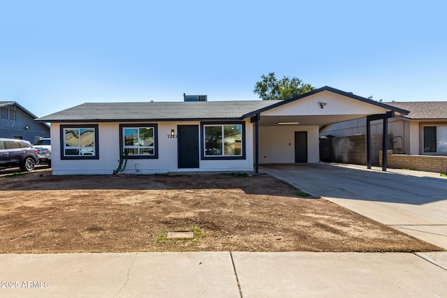 ranch-style house with a carport