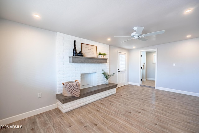 1135 E 4th St, Casa Grande, AZ 85122 - entryway with baseboards, wood finished floors, ceiling fan, a brick fireplace, and recessed lighting