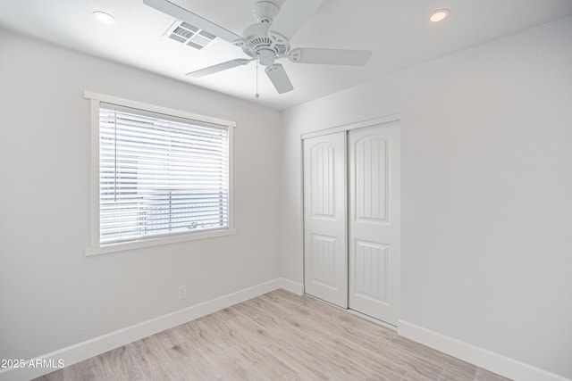 1135 E 4th St, Casa Grande, AZ 85122 - unfurnished bedroom with baseboards, a closet, light wood-style flooring, recessed lighting, and a ceiling fan
