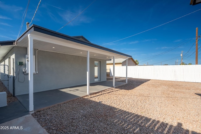 1135 E 4th St, Casa Grande, AZ 85122 - back of house featuring stucco siding and a patio area