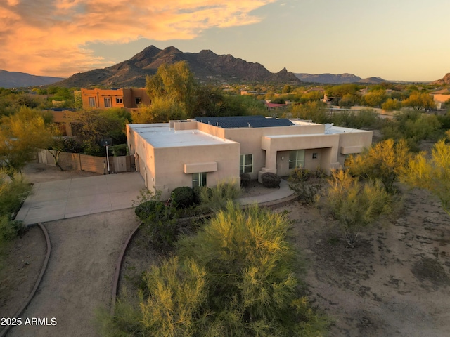 33519 N 62nd St, Cave Creek, AZ 85331 - view of front of house featuring fence, concrete driveway, a mountain view, and stucco siding