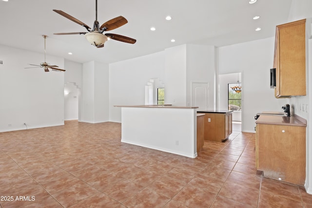 33519 N 62nd St, Cave Creek, AZ 85331 - kitchen with open floor plan, recessed lighting, ceiling fan, a kitchen island, and light tile patterned floors