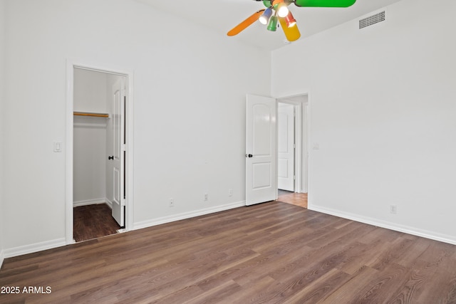 33519 N 62nd St, Cave Creek, AZ 85331 - unfurnished bedroom with a spacious closet, baseboards, wood finished floors, and visible vents