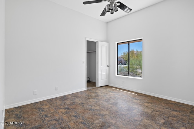 33519 N 62nd St, Cave Creek, AZ 85331 - unfurnished bedroom with a ceiling fan, baseboards, and a towering ceiling