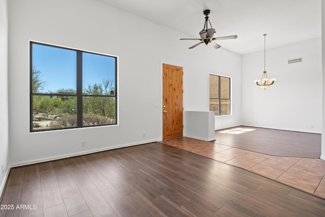33519 N 62nd St, Cave Creek, AZ 85331 - empty room featuring wood finished floors, visible vents, baseboards, and ceiling fan with notable chandelier