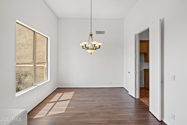 33519 N 62nd St, Cave Creek, AZ 85331 - unfurnished dining area featuring baseboards, visible vents, dark wood-style floors, and a notable chandelier