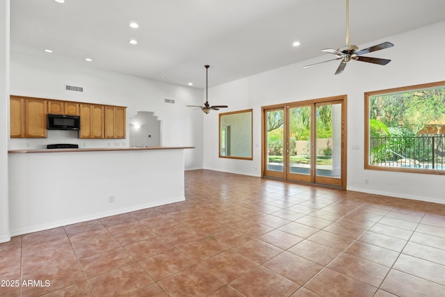 33519 N 62nd St, Cave Creek, AZ 85331 - unfurnished living room with light tile patterned flooring, visible vents, a ceiling fan, and recessed lighting