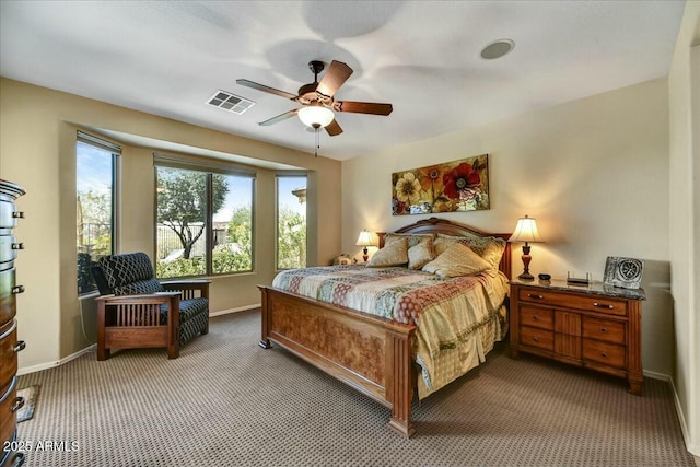 bedroom with ceiling fan, light colored carpet, baseboards, and visible vents