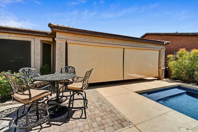 view of patio featuring outdoor dining area