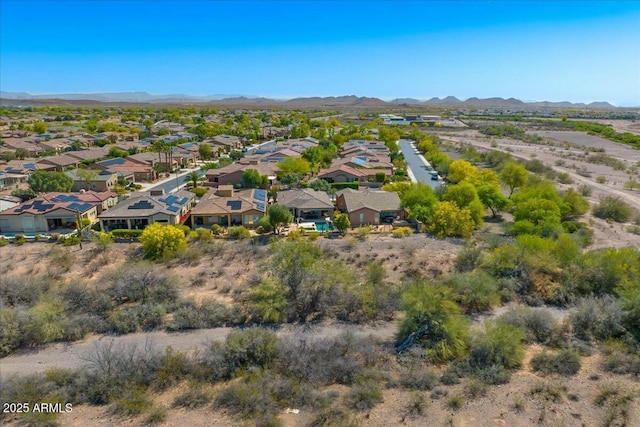 birds eye view of property featuring a mountain view and a residential view