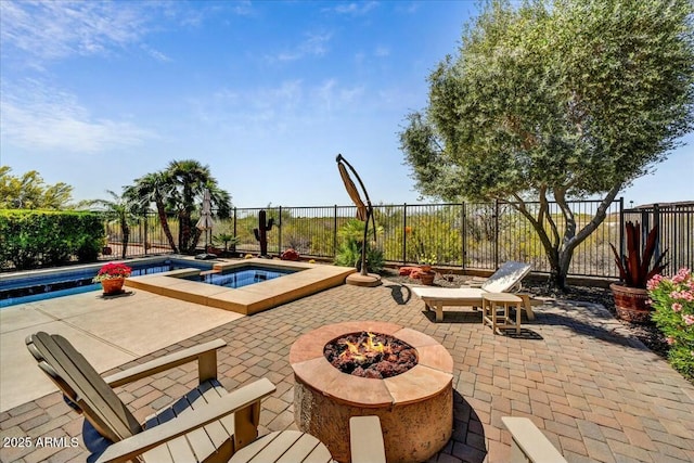 view of pool featuring an outdoor fire pit, a fenced backyard, a patio, an in ground hot tub, and a fenced in pool