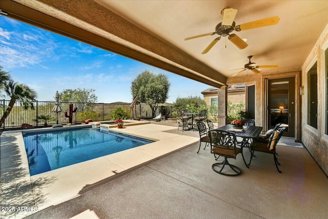 view of pool with ceiling fan, a fenced backyard, a patio area, outdoor dining space, and a fenced in pool