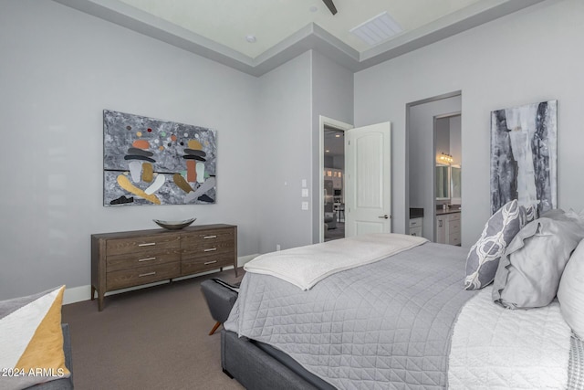 bedroom featuring carpet flooring and ensuite bathroom