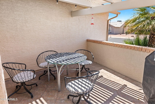 balcony featuring a pergola
