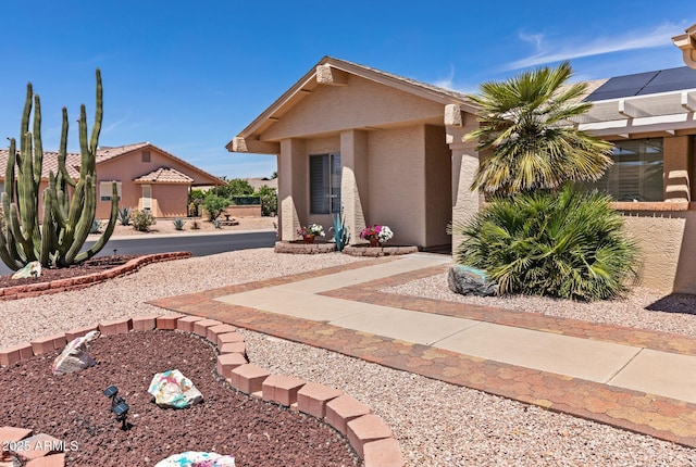 view of front of house featuring stucco siding