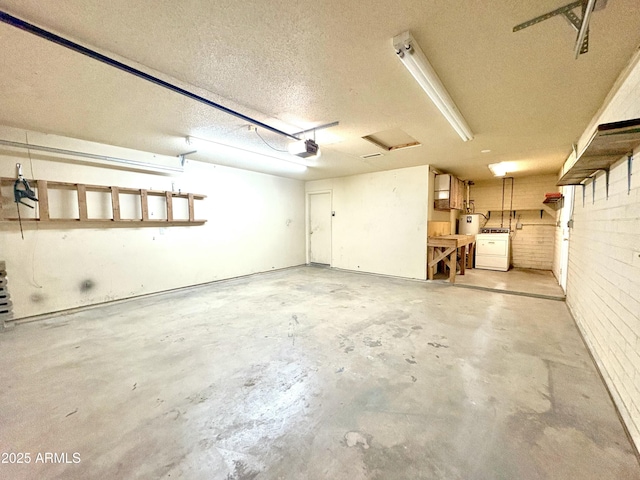 garage with a garage door opener and washer and clothes dryer